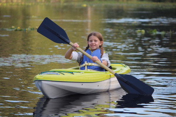photo - kid kayaking at Camp Kalsman