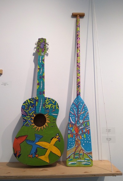 photo - “Folk Guitar” and “Tree of Life Paddle” by Andrew Jackson