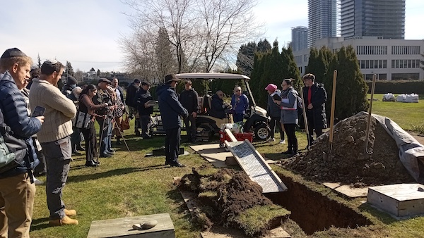 photo - On March 9, community members gathered to bury sacred Jewish texts at Beth Israel Cemetery
