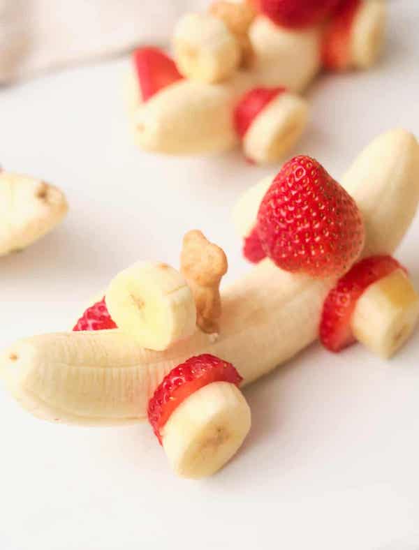 photo - Healthy food can make for a fun snack. The website hello, Yummy has lots of ideas about cooking for and with kids. This banana car with strawberry wheels and a graham cracker bear driver is but one option