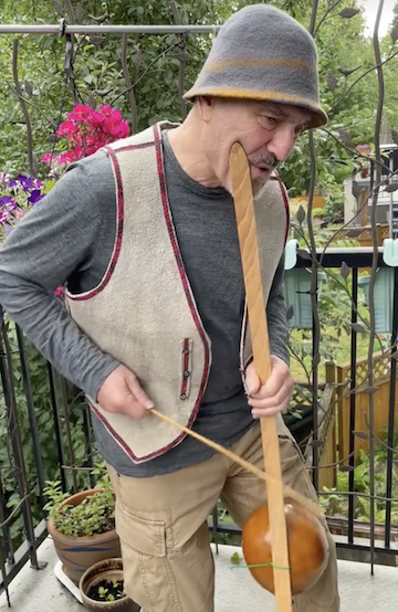 screenshot - Boris Sichon on TikTok, playing an instrument he made himself