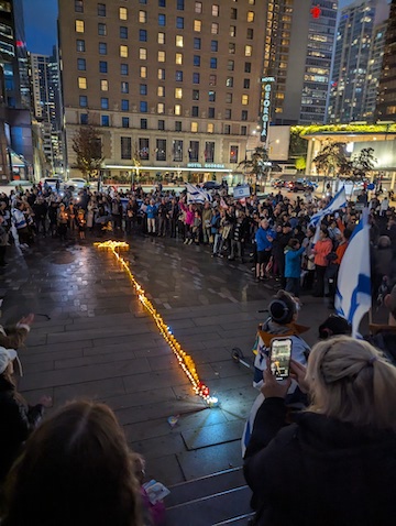 photo - The Monday night vigil was organized by UnXeptable Vancouver