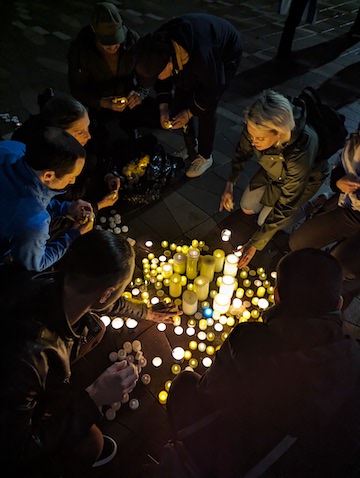 photo - Memorial candles were placed in the shape of a Magen David