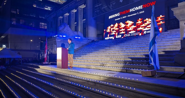 photo - The steps of the Vancouver Art Gallery were illuminated by lights representing those murdered by Hamas on Oct. 7, as the community gathered Nov. 7 to mark shloshim, 30 days of mourning. Here, Ohad Arazi addresses the crowd