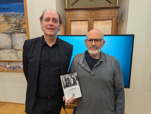 photo - Pierre Anctil, left, and Richard Menkis with a copy of their new book, In a “Land of Hope”: Documents on the Canadian Jewish Experience, 1627-1923