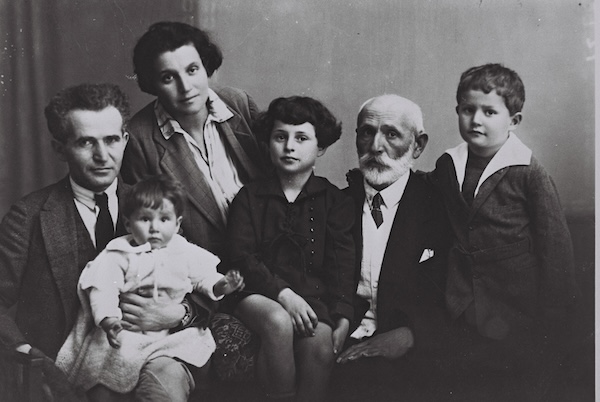photo - The Ben-Gurion family in their Tel Aviv home, 1929. From left: David and Paula with youngest daughter Renana on Ben-Gurion’s lap, daughter Geula, father Avigdor Grün and son Amos