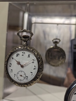 photo - A pocketwatch with Hebrew characters and an engraving of the Western Wall on the reverse