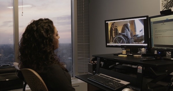 image - A still from the film Stolen Time: lawyer Melissa Miller reviews footage from a long-term-care room camera