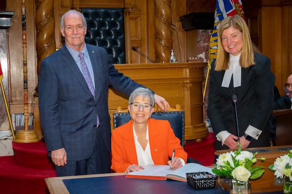 photo - Selina Robinson, centre, with then BC premier John Horgan and Kate Ryan-Lloyd, clerk of the Legislative Assembly, at Robinson’s swearing-in ceremony in 2017