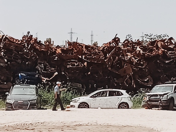 photo - The car graveyard at Moshav Tekuma. The vehicles – recovered from along Highway 232 and the site of the Nova music festival – are being kept for at least a year, for investigators to scour them for further evidence