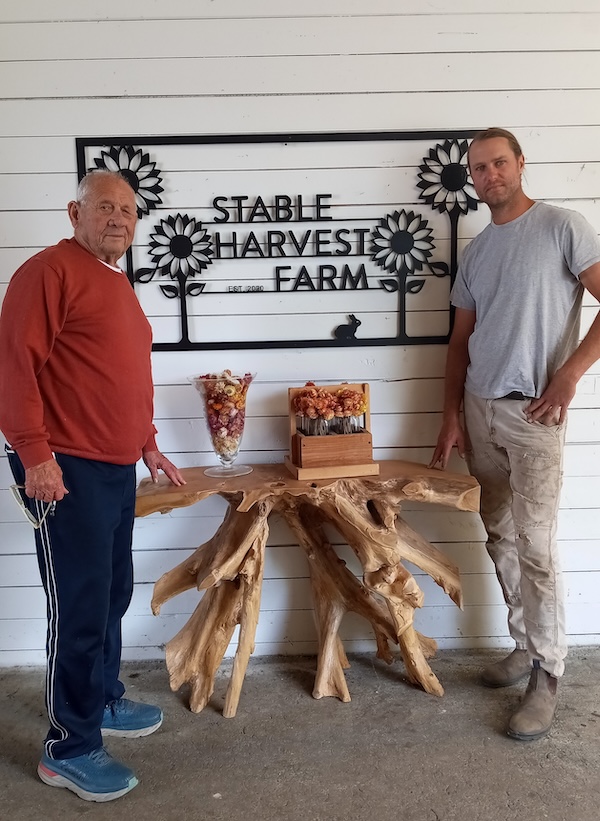 photo - Syd Belzberg, left, owner of Stable Harvest Farm in Langley, and farm manager Kristjan Johannson
