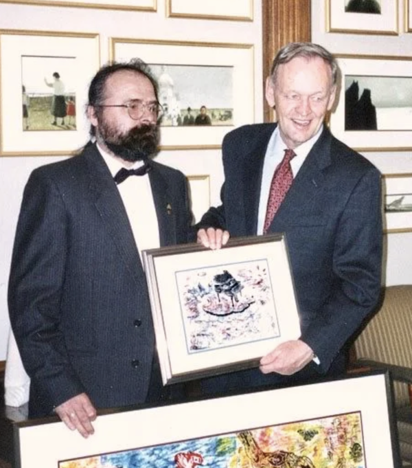 photo - Imre Székely, left, gives his artwork to then-prime minister Jean Chrétien