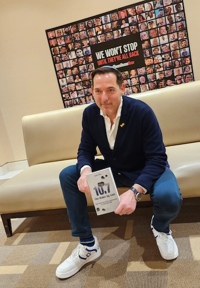 photo - Author Israel Ellis with his new book, The Wake Up Call, after a Feb. 10 talk at Beth Tikvah Synagogue in Toronto, where he joined journalist Dave Gordon in conversation