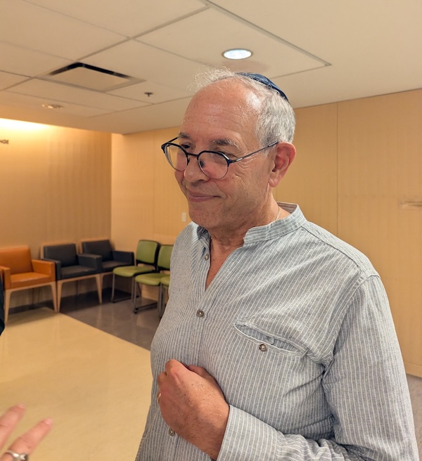 photo - Dr. Ted Rosenberg speaks with an audience member at the Medical Outcomes of Emerging Antisemitism event held at Beth Israel Sept. 4