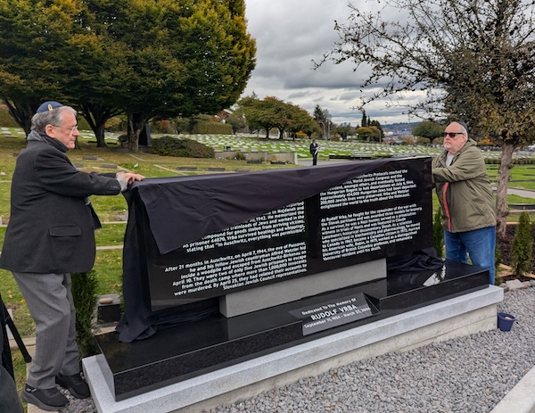 photo - Robert Krell, left, founding president of the Vancouver Holocaust Education Centre, and Al Szajman, the current president, unveil the monument to Rudolf Vrba at Schara Tzedeck Cemetery