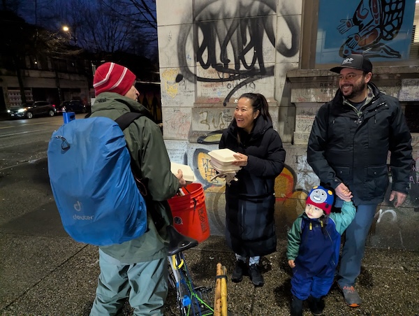 photo - On the fifth night of Hanukkah, Jewish community members delivered latkes and sufganiyot in the Downtown Eastside