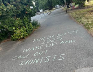 photo - Because chalk is temporary and easily reapplied, the individual can rewrite messages almost as soon as they are washed away