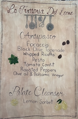 photo - The first page of Lion's Den 2026's menu, all prepared by King David High School students. (photo from KDHS)