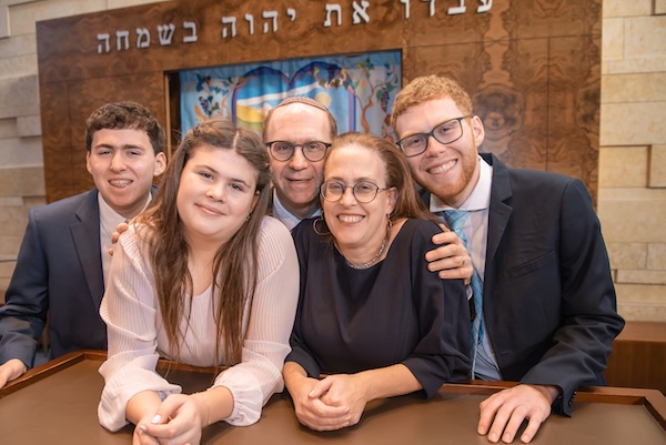 photo - their kids, left to right, Yair, Naomi and Avishai. Congregation Beth Israel’s Be the Light Gala on June 4 celebrates Infeld’s 20th year as the synagogue’s spiritual leader. The rabbi says he and his family have “been very lucky to raise a family here and help build a synagogue”