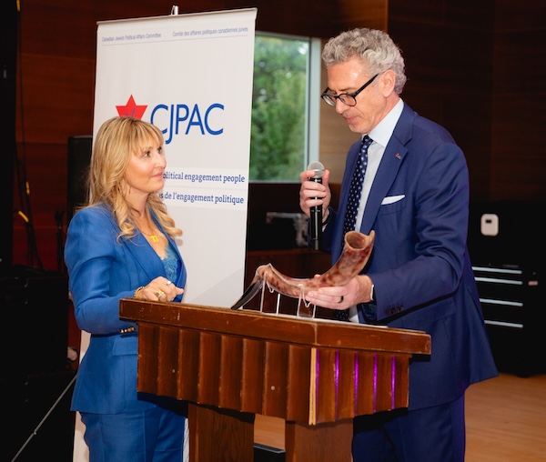 photo - Lana Marks Pulver receives the 2026 CJPAC Impact Award from Mark Waldman, chief executive officer and co-founder of the Canadian Jewish Political Action Committee