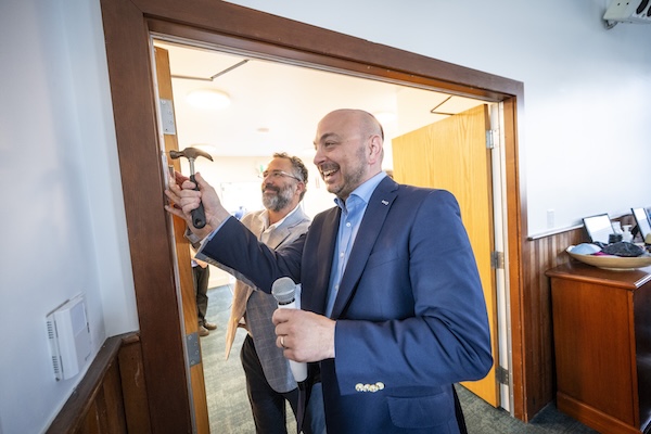 photo - Rabbi Arik Labowitz, left, and Jewish Federation of BC’s Ezra Shanken participate in the mezuzah hanging