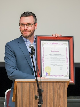 photo - Vancouver City Councilor and Deputy Mayor Peter Meiszner holds the city’s proclamation of April 19 as Raoul Wallenberg Day