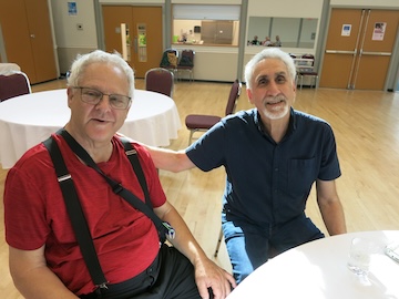 photo - Gary Cohen, one of the original members of Tzimmes, with band founder and leader Moshe Denburg, right
