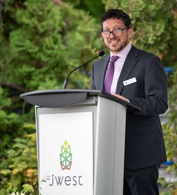photo - Dr. Seth Goldsweig, head of King David High School, speaks at the ceremony