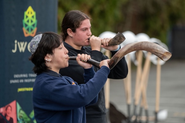 photo - Sarah Kleiner and Abby Strauber sound the shofar