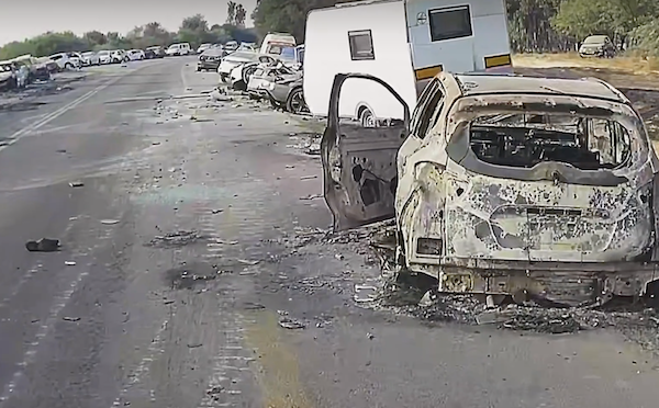 screenshot - Burned-out vehicles line the roads where Nova Festival attendees sought to escape before being ambushed by armed terrorists who had invaded from Gaza