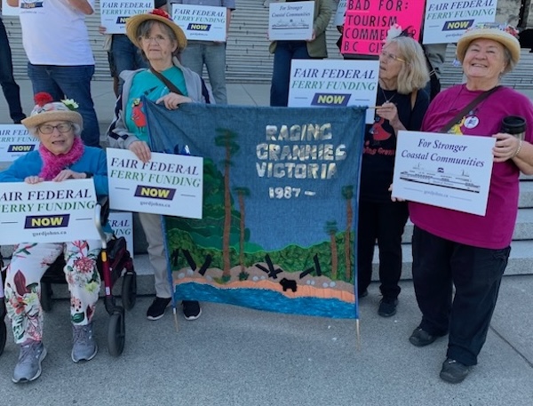 photo - The Raging Grannies on the steps of the BC legislature; Freda Knott is on the left